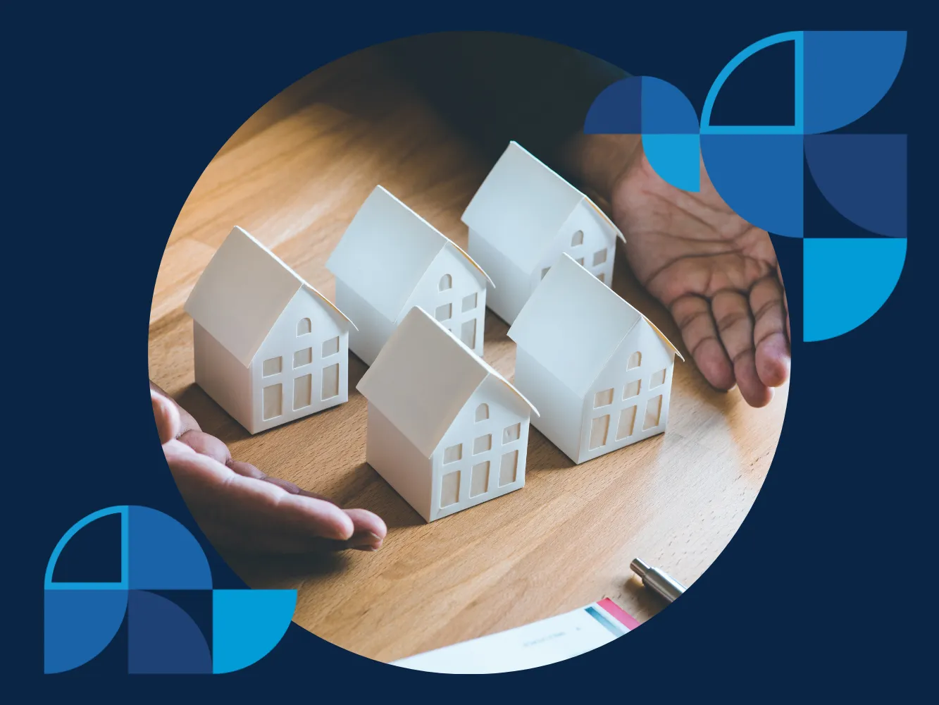 Image of five white miniature houses on a desk, depicting the types of rental properties for real estate investment.