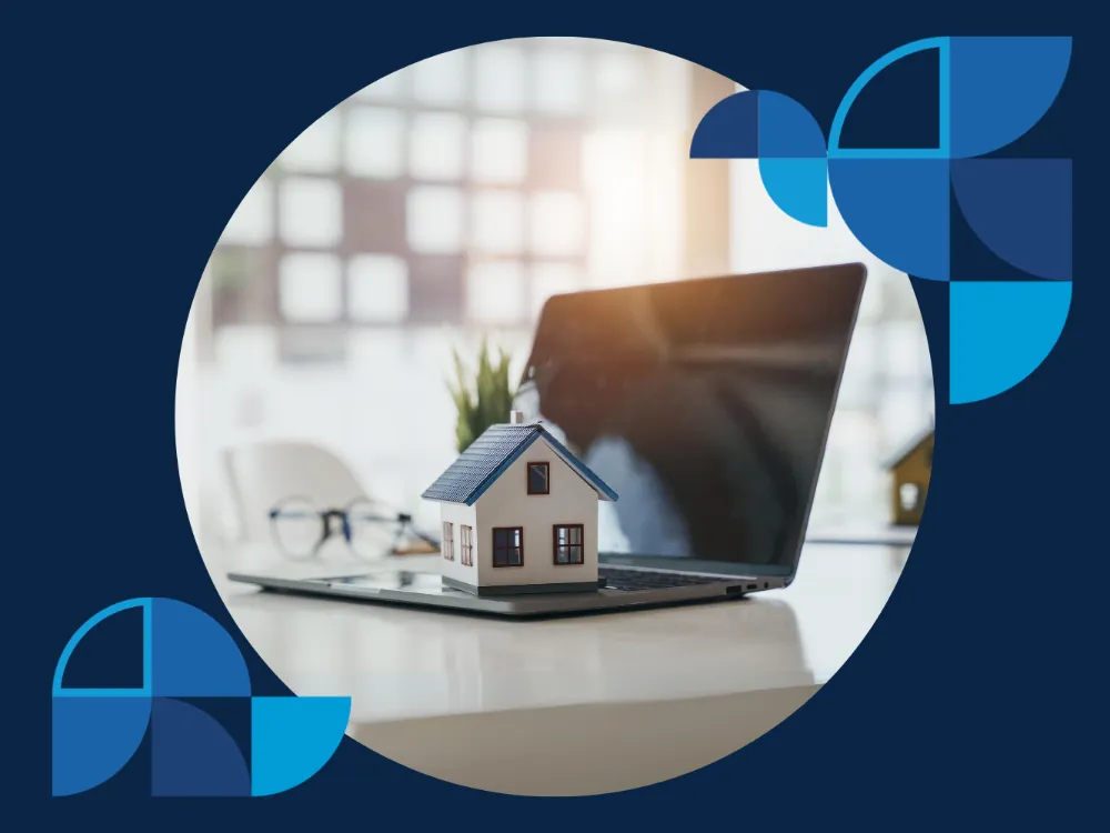 Miniature house standing on top of a laptop on a desk, illustrating the steps to becoming a landlord and providing insights on how to become a landlord.